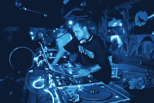 bsychld behind the decks, hands on a record